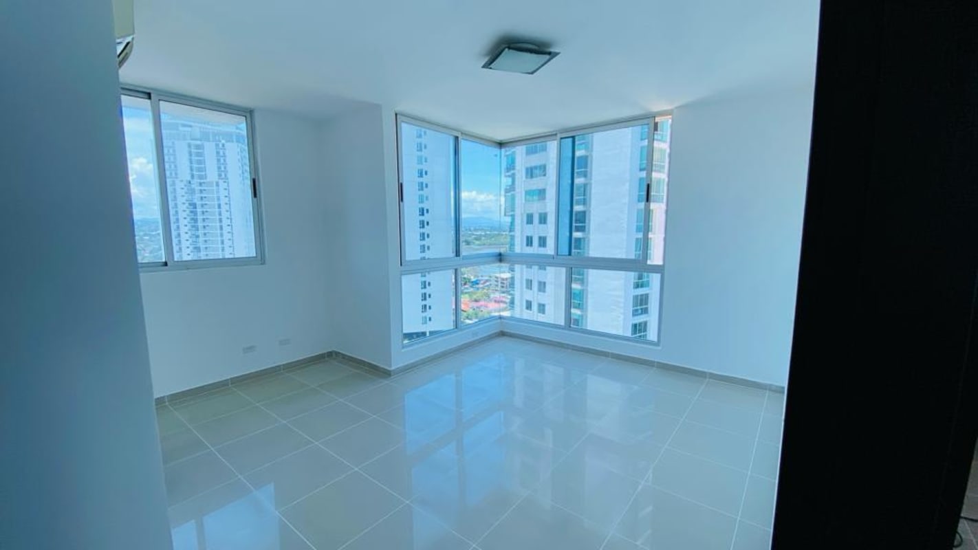 Master bedroom with large windows walk-in closet and ocean views in Vision Tower Panama