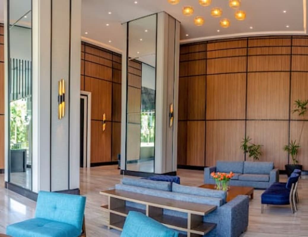 Modern rooftop pool with skyline views surrounded by glass at PH Park Lane Costa del Este Panama