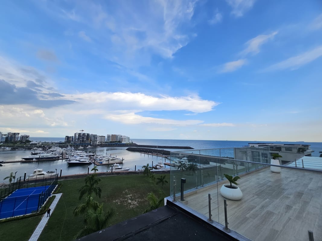 Spacious balcony with glass railing overlooking marina and yachts at PH Garden Apartments Ocean Reef Panama
