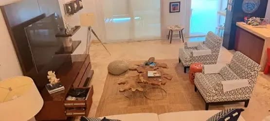 Open bright living and dining room with garden view in Buenaventura Resort Panama