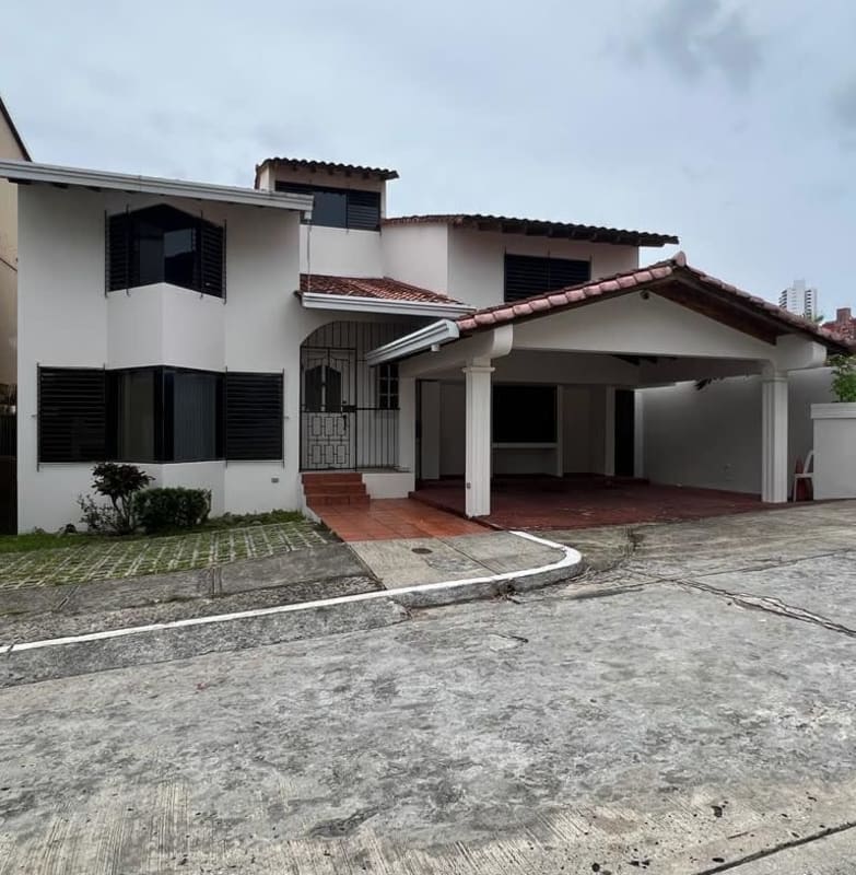 Dining space with wooden table, art decor windows ceiling fan Villa de las Fuentes Panama