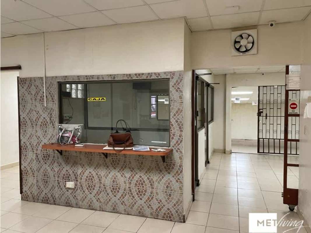 Reception counter with mosaic tile wall in commercial building Panama