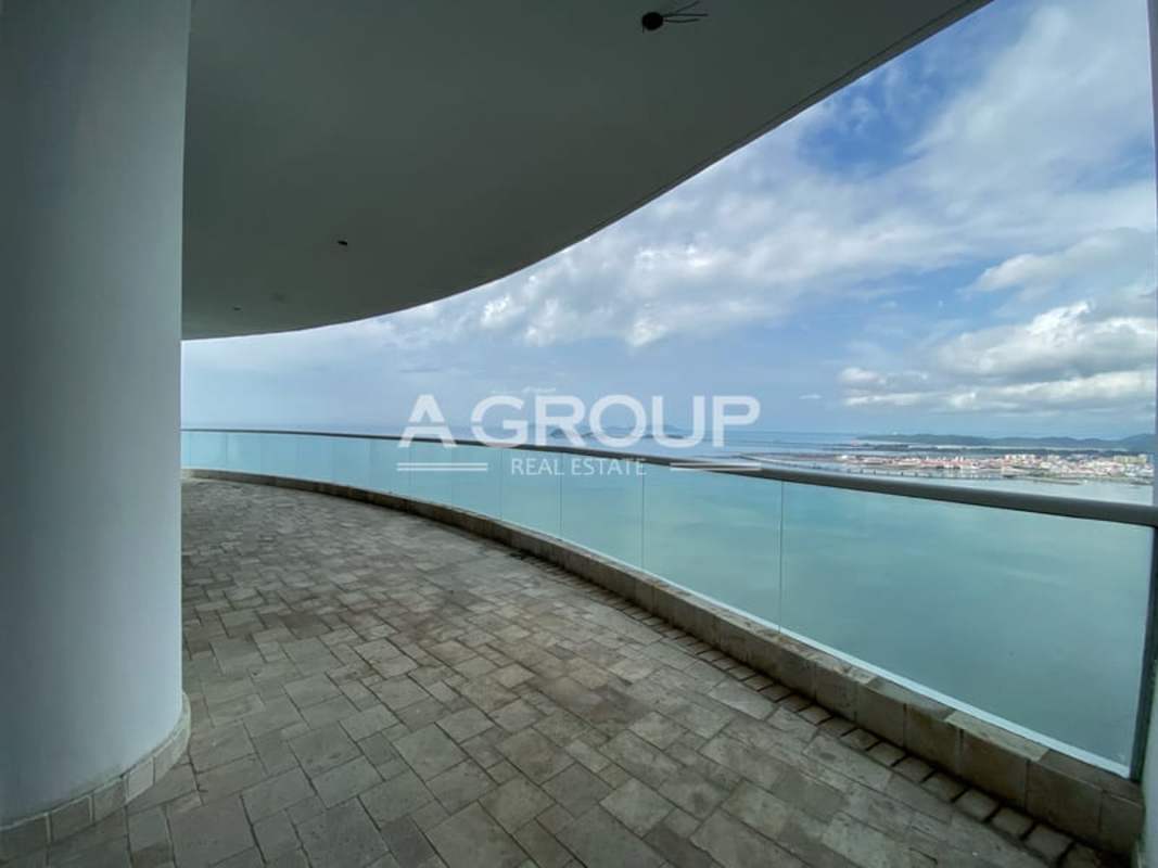 Luxury living and dining space floor-to-ceiling windows ocean view marble floors The Point