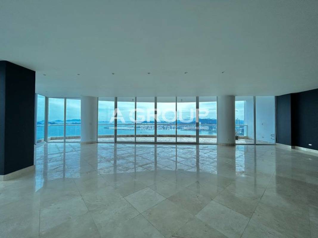 Curved balcony terrace with glass railing overlooking Pacific Ocean at The Point Panama