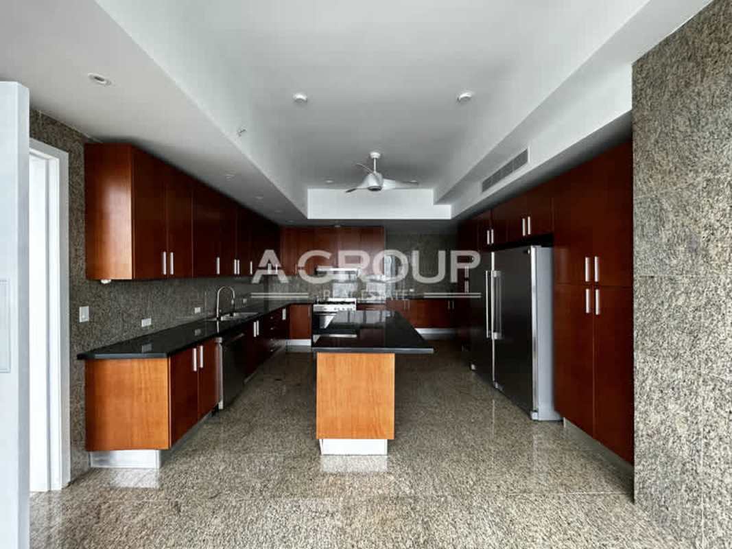 Modern bedroom with marble flooring built-in closet large windows at The Point Panama