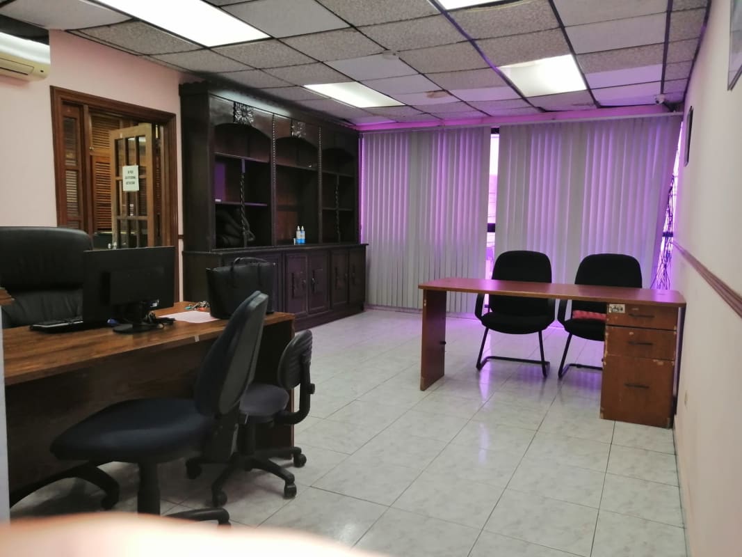 Office interior with desks, bookshelf, AC, tiled flooring commercial building Obarrio Panama