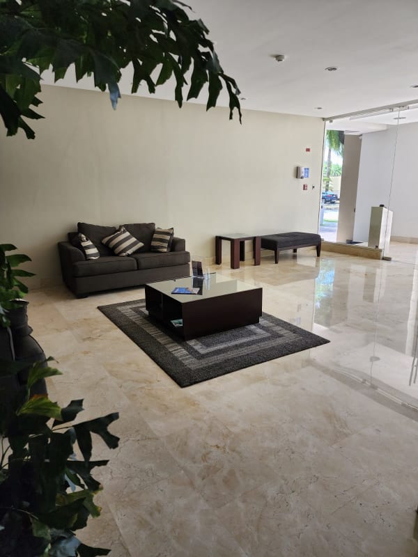 Modern bathroom with marble finishes and glass shower enclosure PH Alcalá Costa del Este Panama