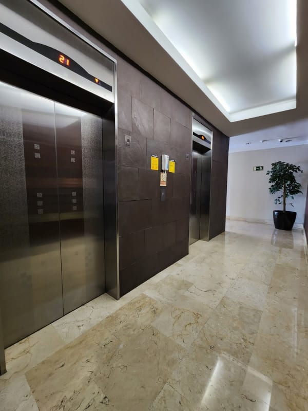 Elegant marble elevator lobby with stainless elevators at PH Alcalá Costa del Este Panama