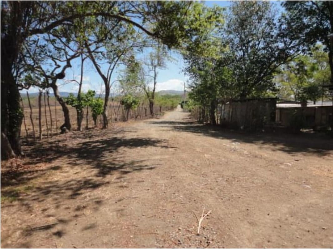 Rural property dirt access road with scenic countryside view in San Martín Panama