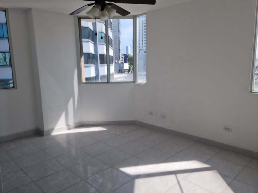 Bright bathroom with marble tiles, glass shower door and sink PH Brisas de San Fernando Panama
