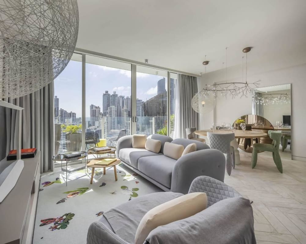 Spacious living and dining area with floor-to-ceiling windows and ocean view at Wanders & Yoo Panama