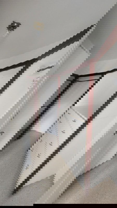 Retro bathroom with beige fixtures, marble vanity, sliding glass shower at Park City Obarrio Panama