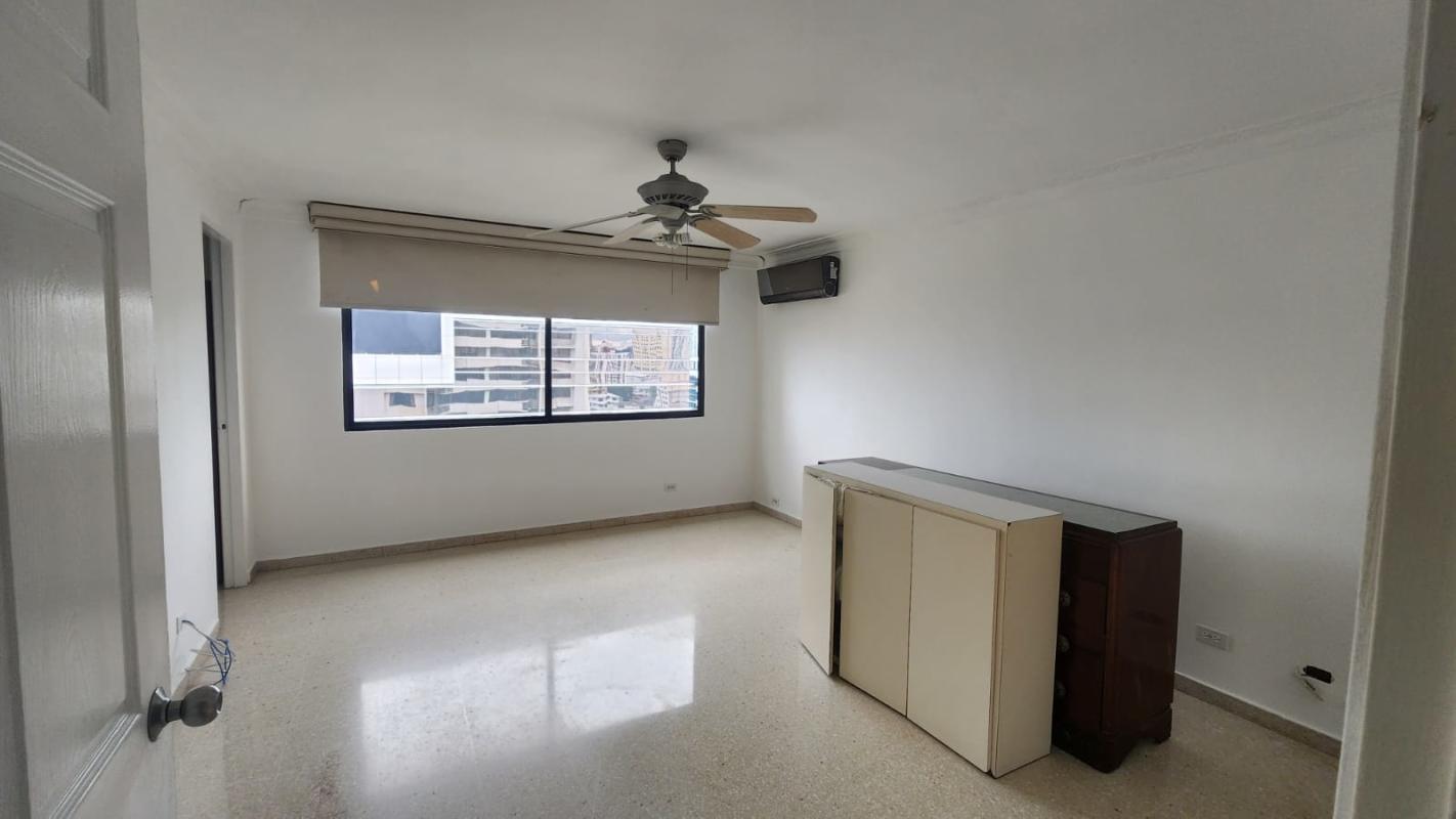 Bright bedroom with city view large windows built-in closet Obarrio Panama City