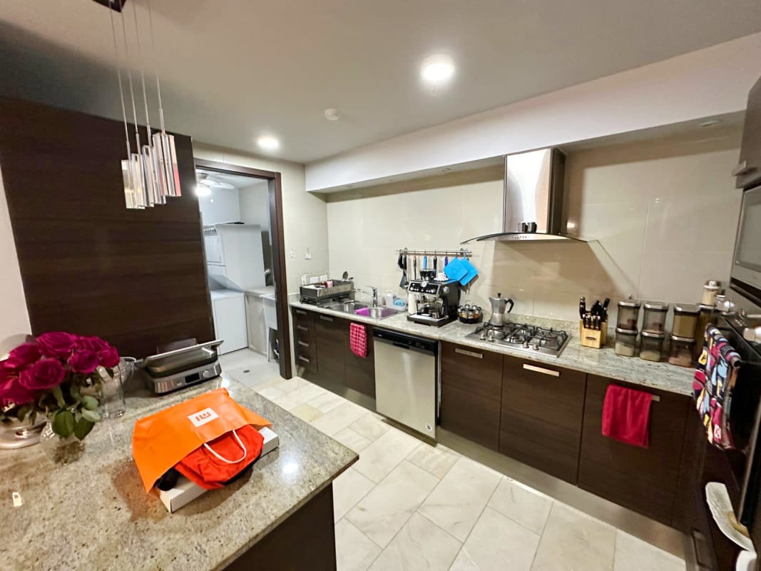 Luxury kitchen with granite countertops, stainless steel appliances in Grand Tower Punta Pacifica Panama City