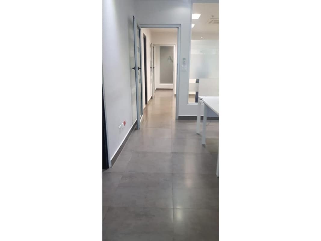 Office corridor with glass partitions and doors BICSA Tower Panama