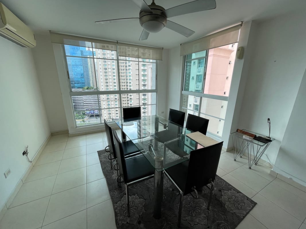 Closed kitchen with granite counters, wood cabinets at PH Costa Pacifica Punta Pacifica Panama
