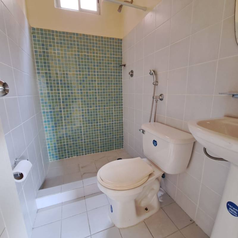 Small bathroom with pedestal sink and shower PH Mystic Village Don Bosco Panama