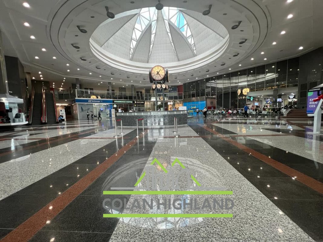 Spacious atrium lobby with skylight, modern design inside Torres de Las Américas Panama