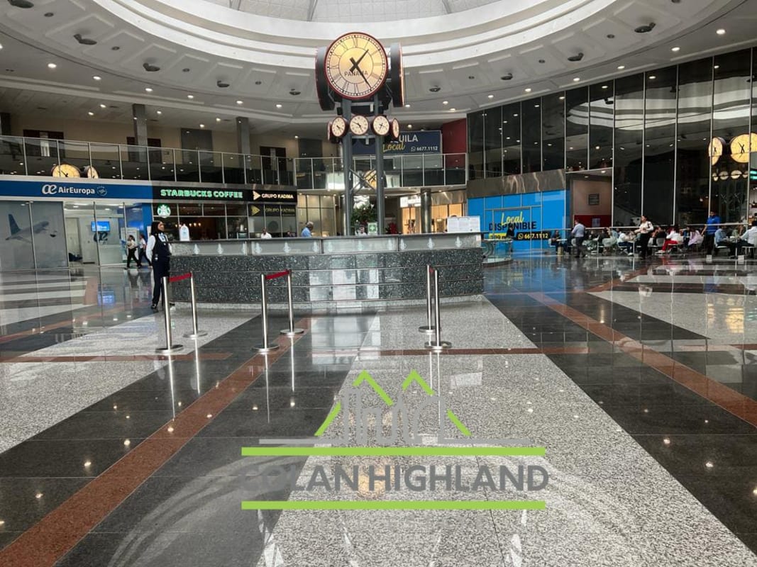Spacious modern concourse with clock atrium inside Torres de Las Américas Panama