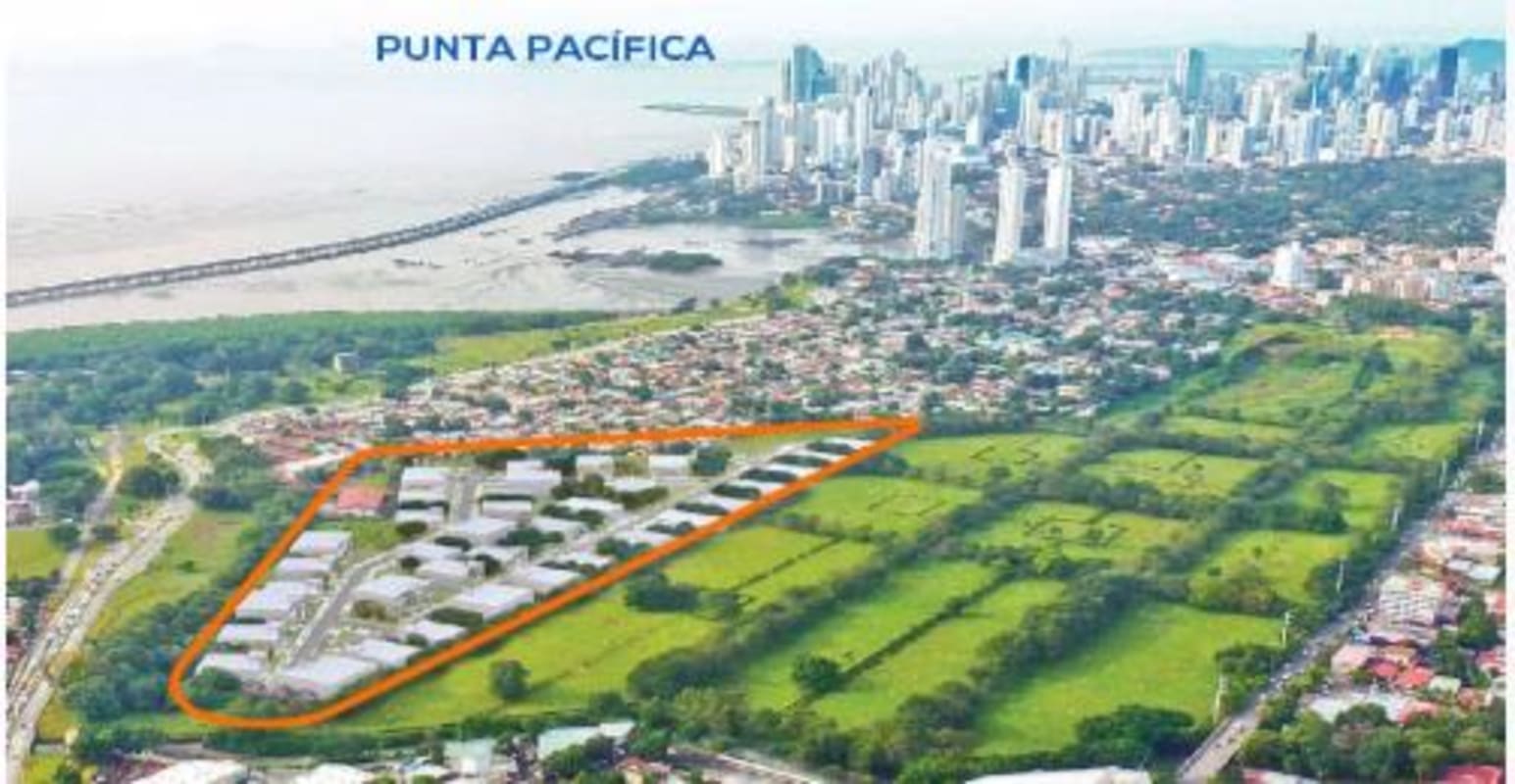 Large empty warehouse interior with polished concrete floor and mezzanine level.