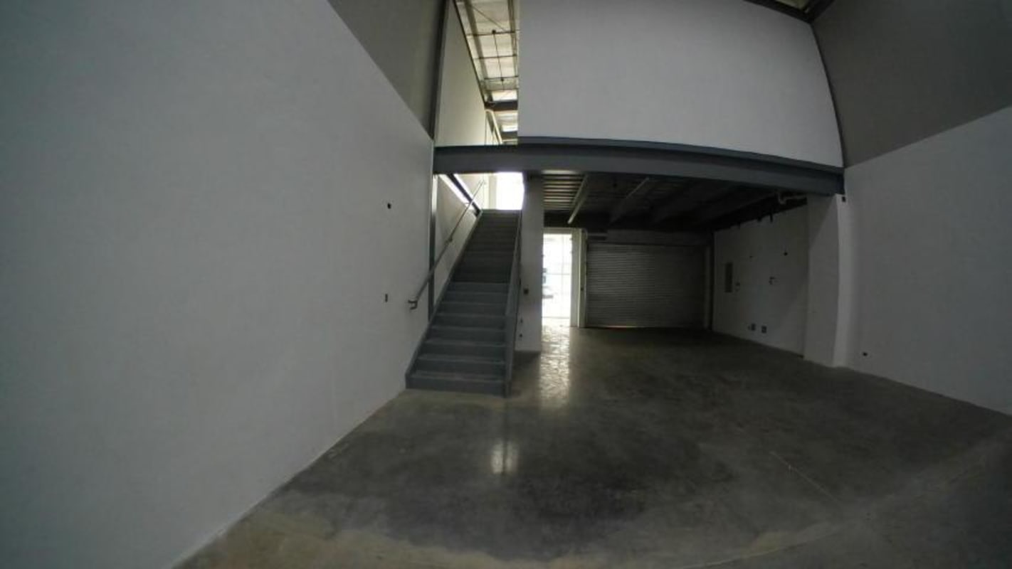 Industrial warehouse mezzanine level viewed from ground floor at Panama Viejo Business Center.