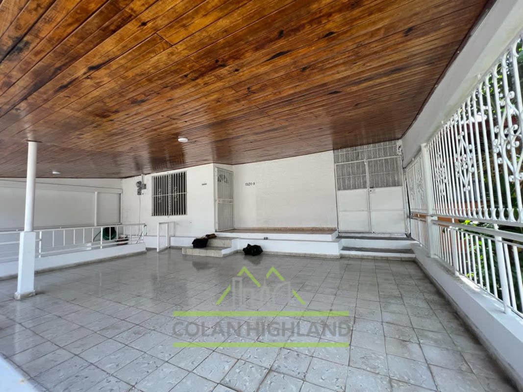 Large covered terrace with wood ceiling and white railings Cerro Viento Panama