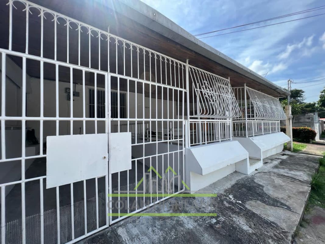 Spacious tiled living room with ceiling fan and bright windows in house Cerro Viento for sale