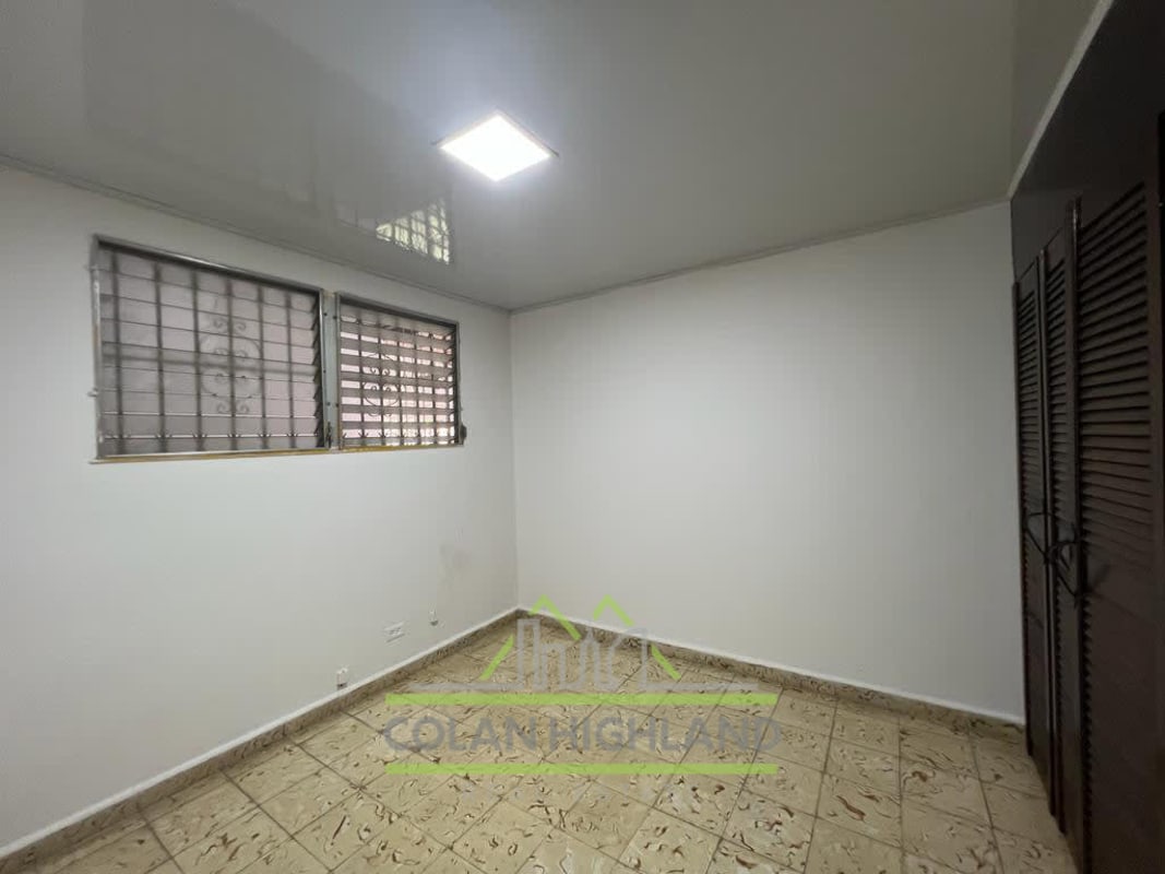 Bathroom with yellow tiles, walk-in shower, toilet, sink Cerro Viento home Panama