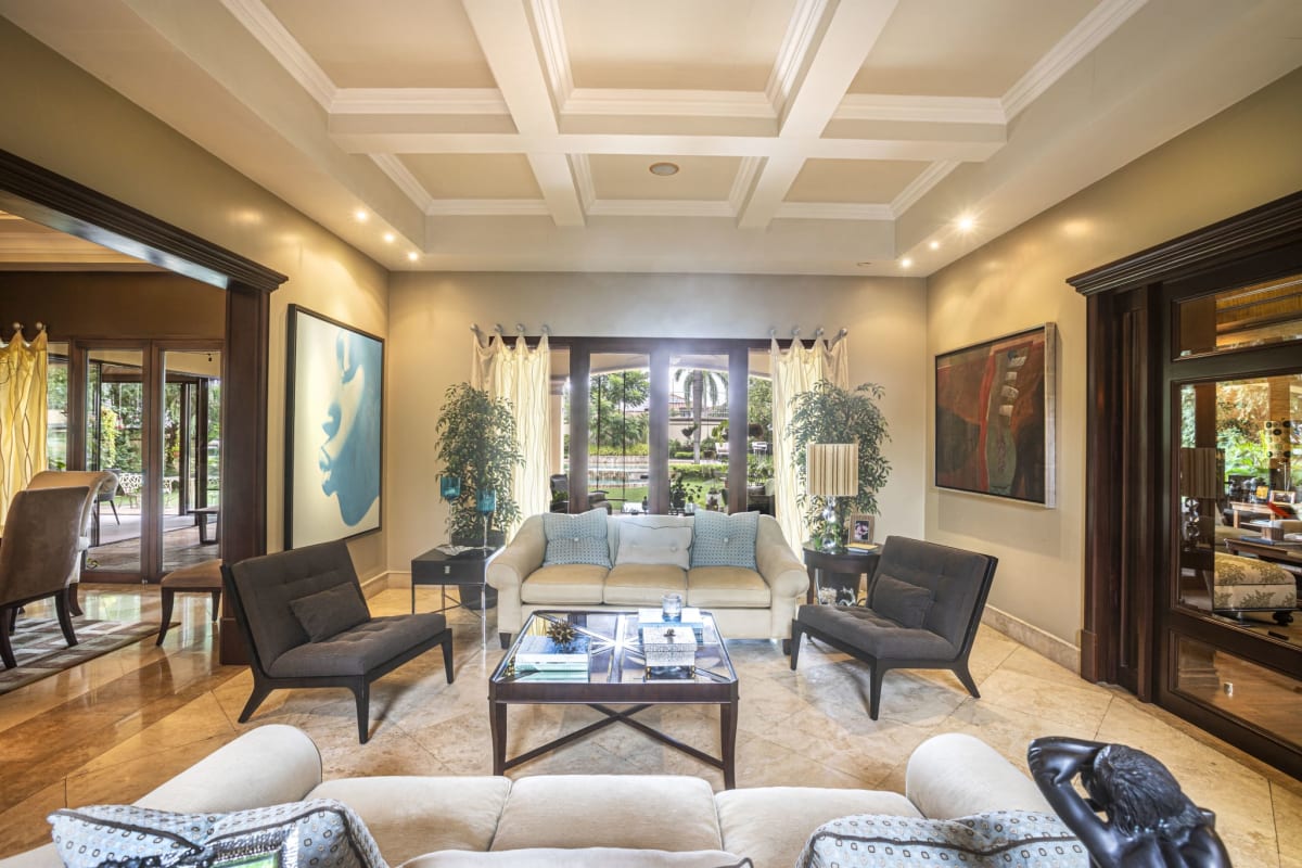 Elegant contemporary living space with marble floors, coffered ceilings, bright windows, Costa del Este Panama