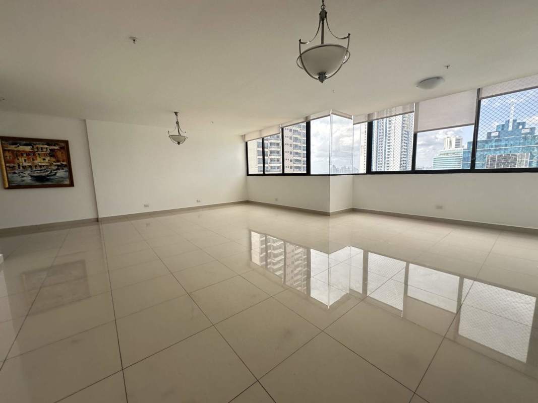 Spacious living room with panoramic ocean view windows in PH Brisa Marina Panama