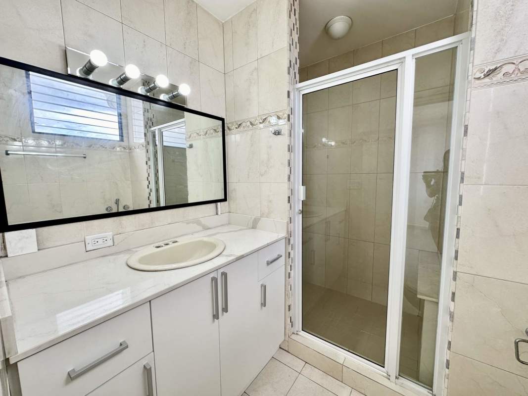 Contemporary full bathroom with walk-in shower and vanity at PH Coco Bay Coco del Mar