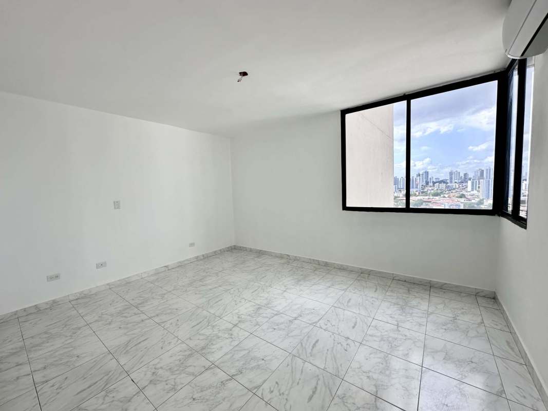 Bedroom featuring marble floors, AC, and skyline views in PH Coco Bay Coco del Mar