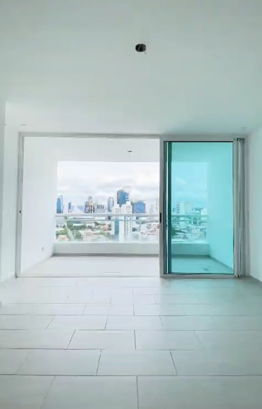 Kitchen with L-shape layout, gray cabinets, dual sink in PH The Towers Residences San Francisco Panama City