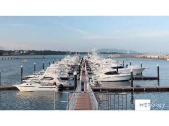 Yacht marina with waterfront promenade during sunset at Vista Mar Resort Panama