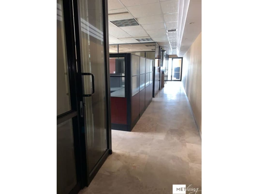 Large open office area with windows and ocean view at Torre BAC, Avenida Balboa Panama