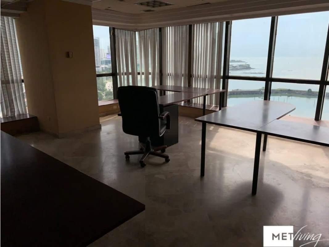 Glass walls and city views inside Torre BAC office Panama City