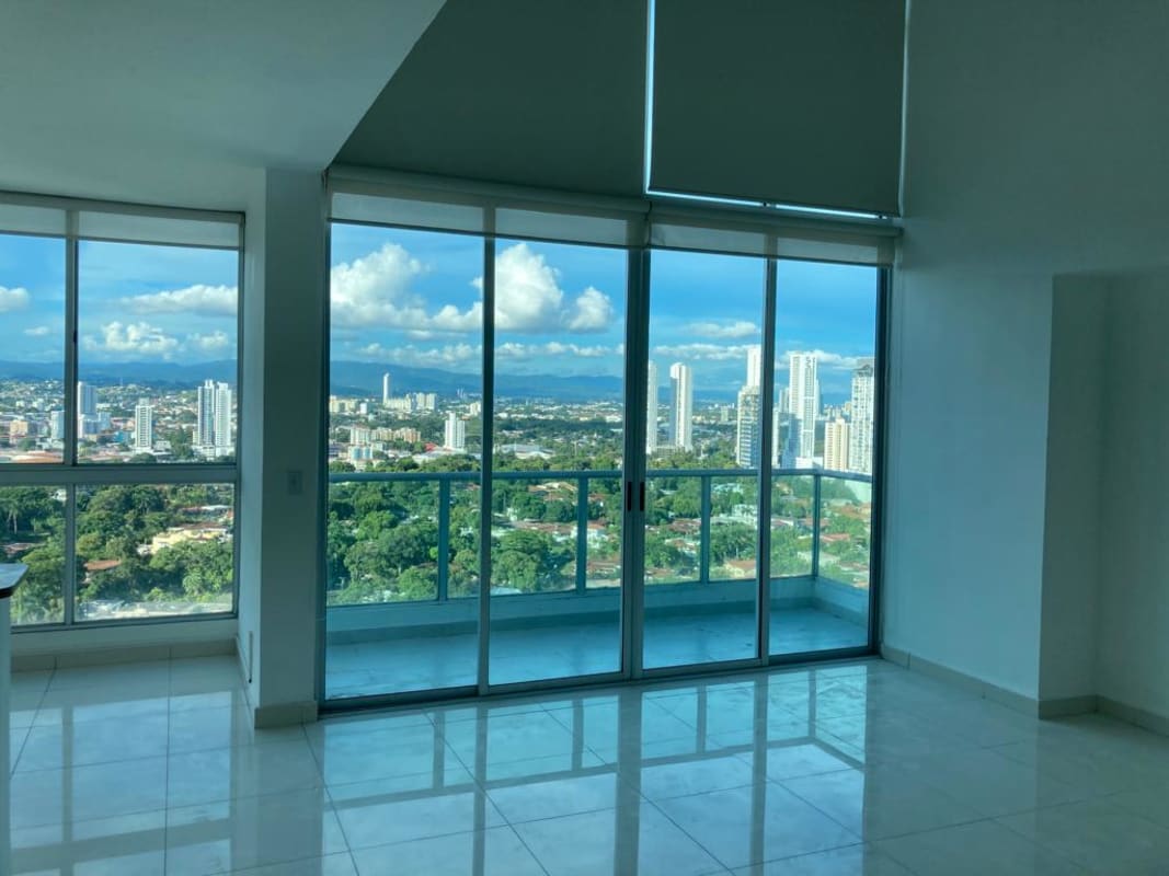 Double height loft living room with floor-to-ceiling windows in Park Loft Panama