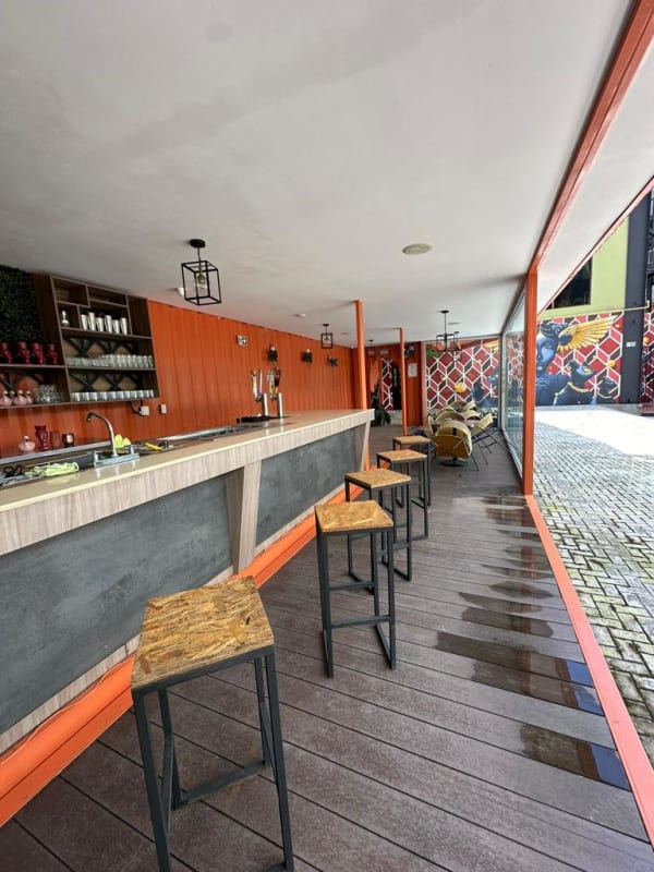 Modern industrial commercial space with bar counter and windows in Costa del Este Panama