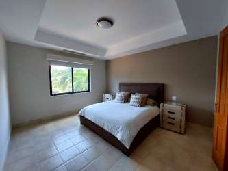 Contemporary kitchen with granite countertops, stainless appliances in Buenaventura Resort Panama