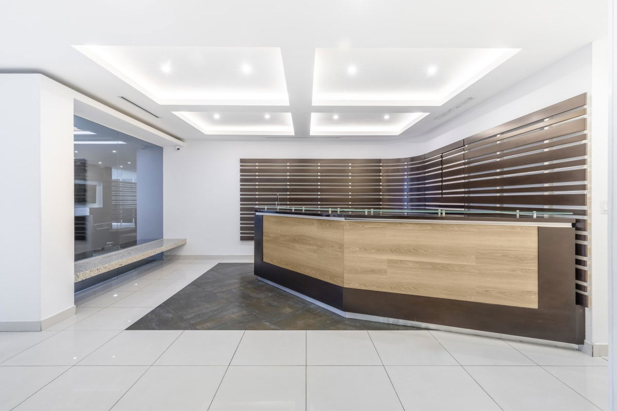 Reception area with wood paneling glass walls modern design Panama