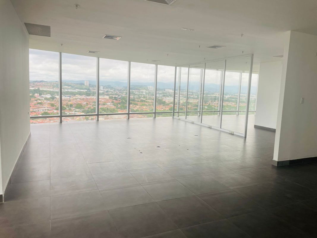 Spacious empty corporate office area glass walls panoramic windows PH Aseguradora Ancón Panama