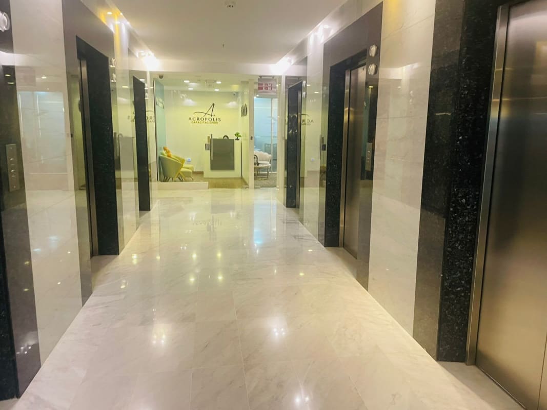 Costa del Este skyline from inside modern corporate office floor to ceiling glass PH Aseguradora Ancón Panama