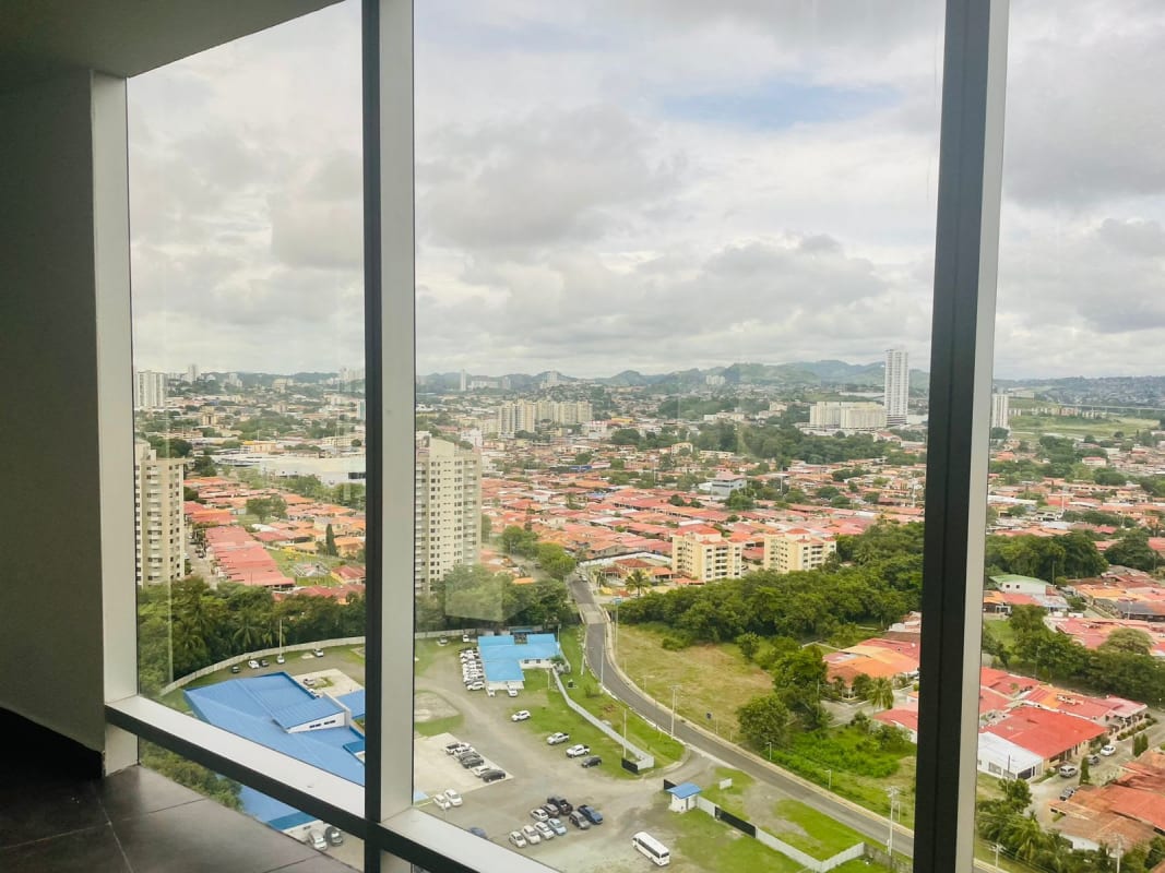 Panoramic cityscape vista through floor to ceiling glass office windows PH Aseguradora Ancón Costa del Este