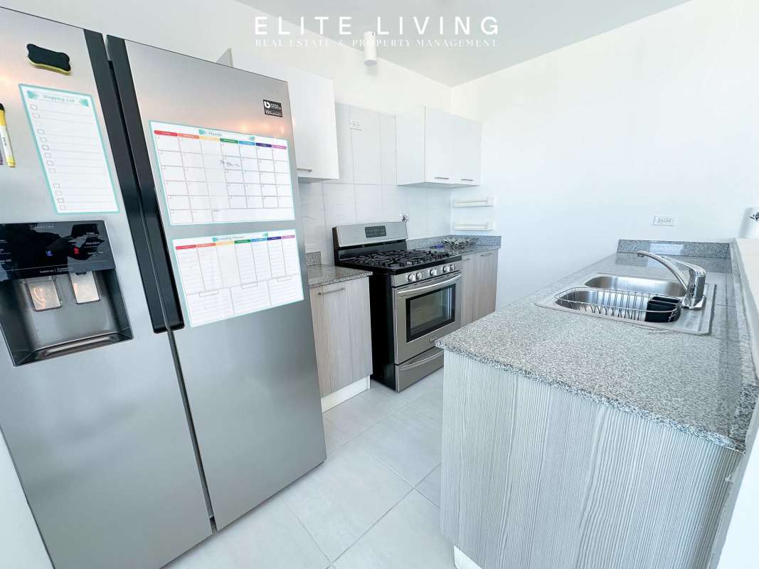 Open plan living room with tile floor and balcony view in PH Metropolitan Park Carrasquilla Panama