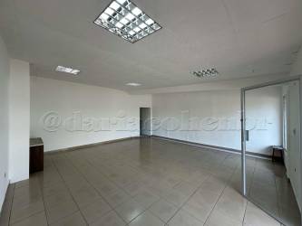 Wide glass storefront windows with tiled sidewalk Chitré Panama commercial retail for lease