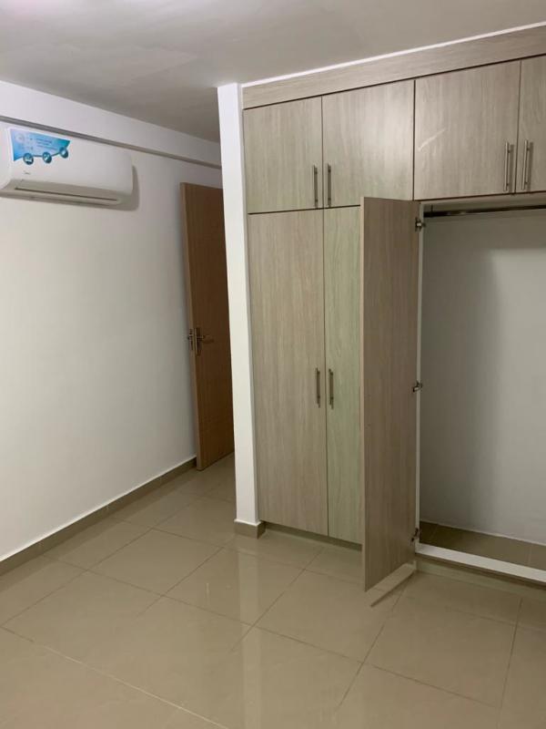 Bedroom with beige tile floor, built-in wardrobe PH River One Rio Abajo Panama