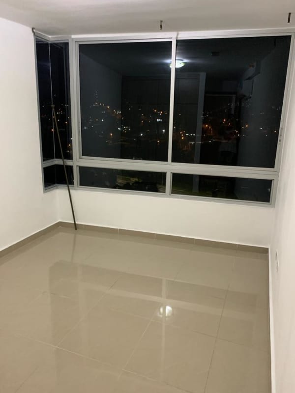 Empty modern apartment room with large windows and night city view PH River One Panama