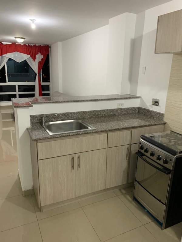 Minimalist kitchen granite countertop, beige tiles PH River One Rio Abajo Panama