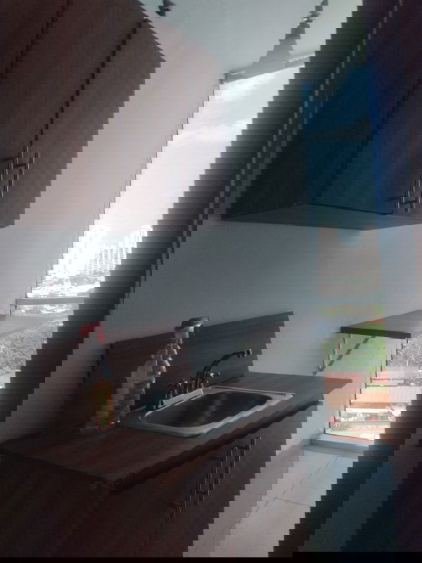 Compact kitchenette in luxury office PH Brasil 405 with wooden cabinetry and city views