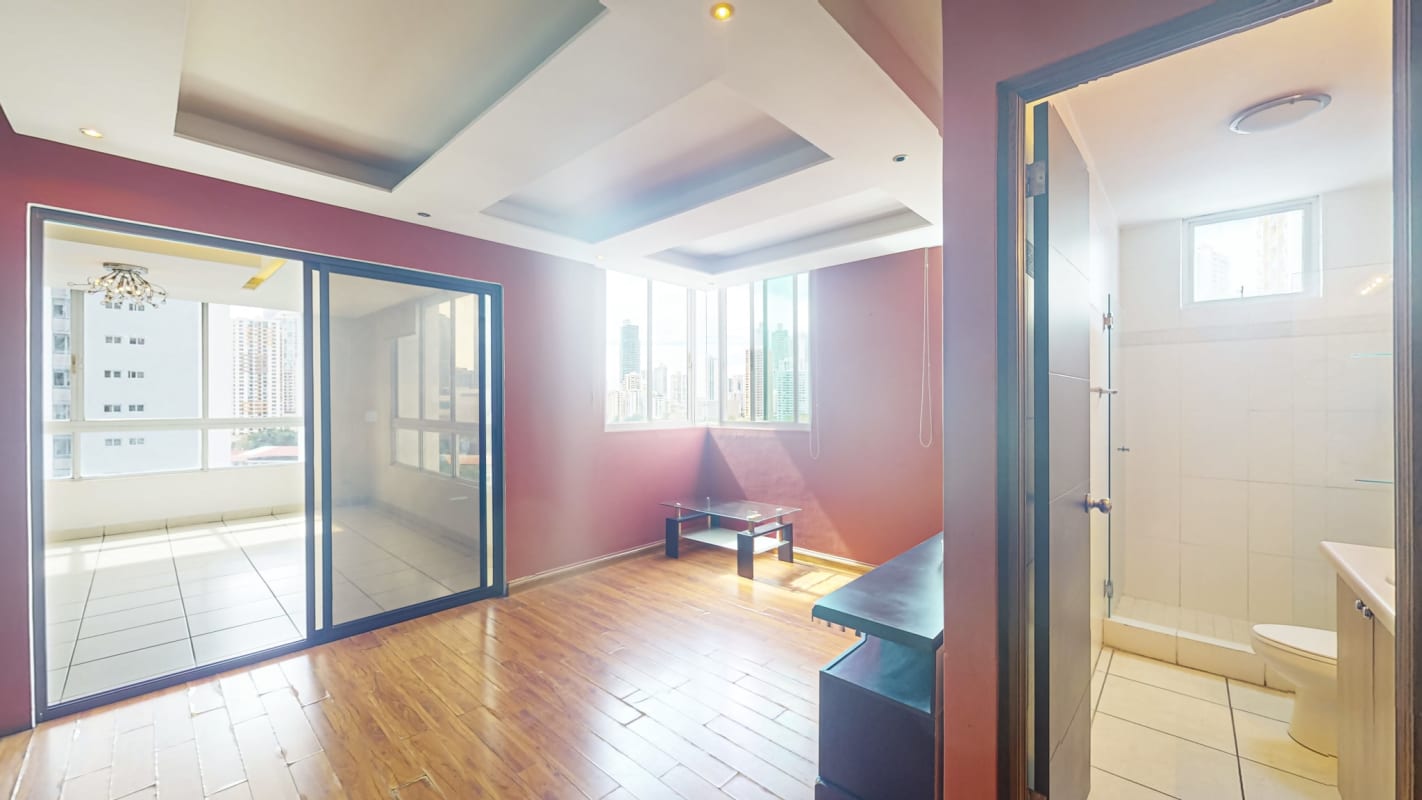 Closed kitchen with granite countertops and wooden cabinets at PH Bahía Obarrio San Francisco Panama